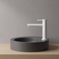 Robinet lavabo Aura blanc mat installé sur une vasque à poser