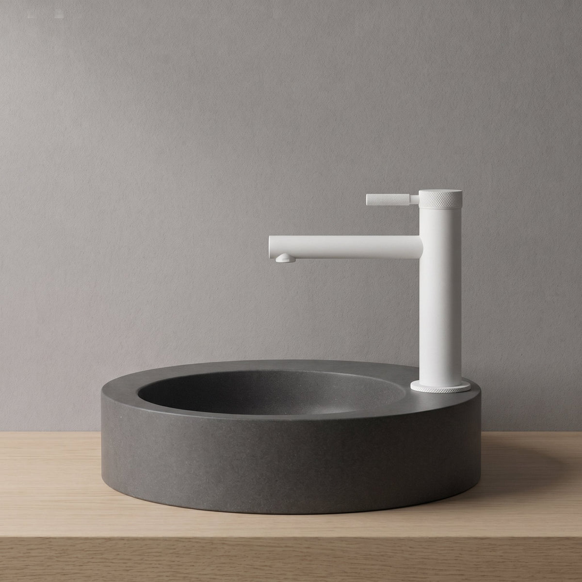 Robinet lavabo Aura blanc mat installé sur une vasque à poser