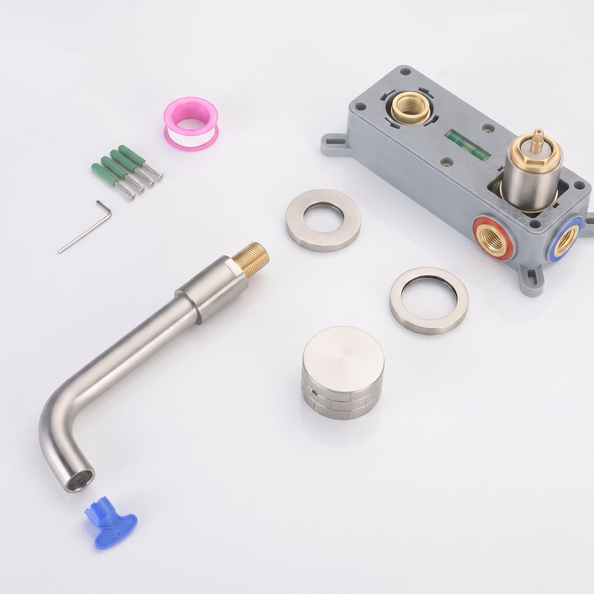 Contenu du kit du robinet mural Linea : bec, molette, rosaces et joints